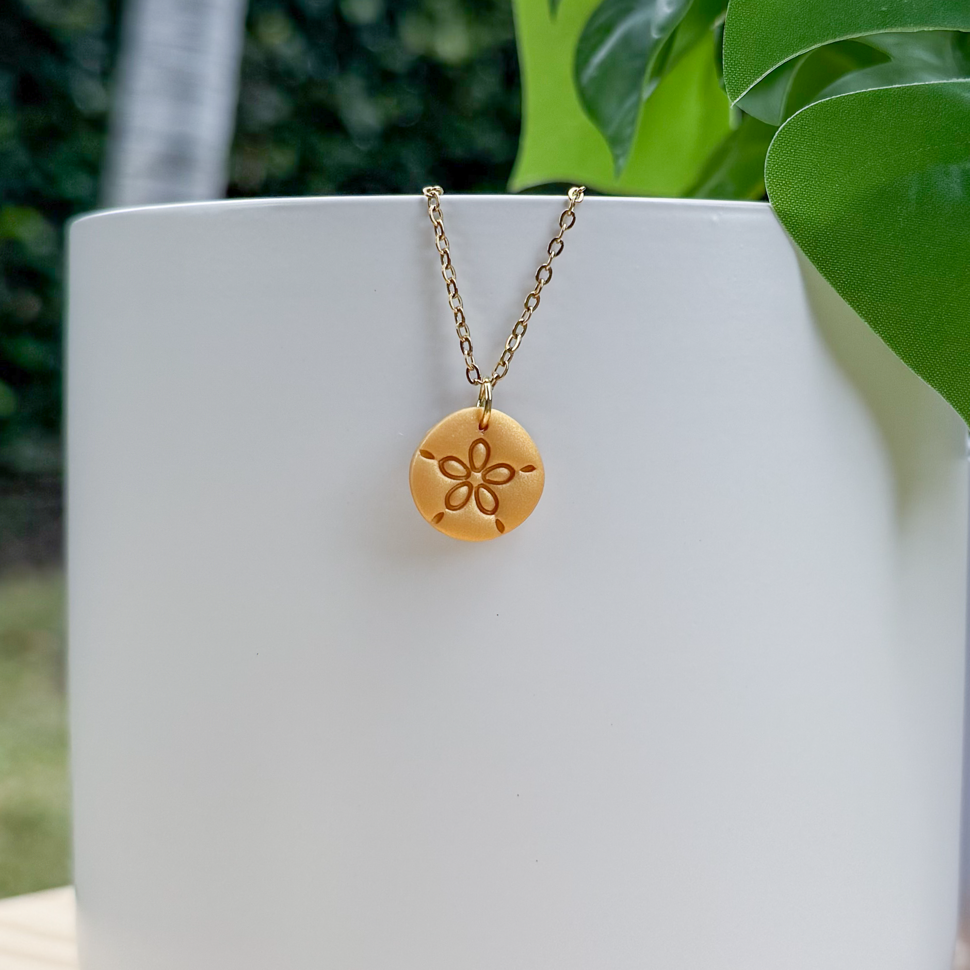 Sand dollar charm necklace