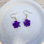 Violet flower dangles with leaves