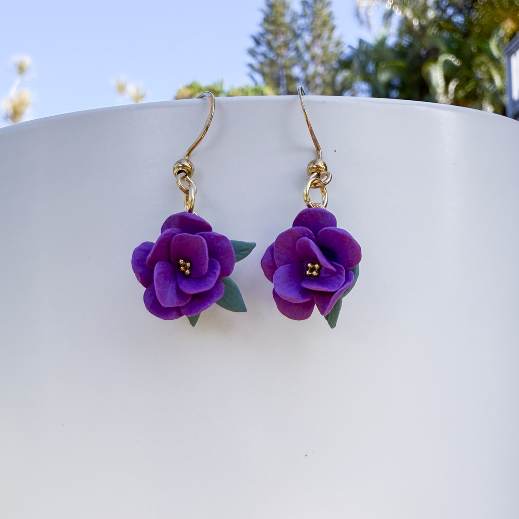 Violet flower dangles with leaves
